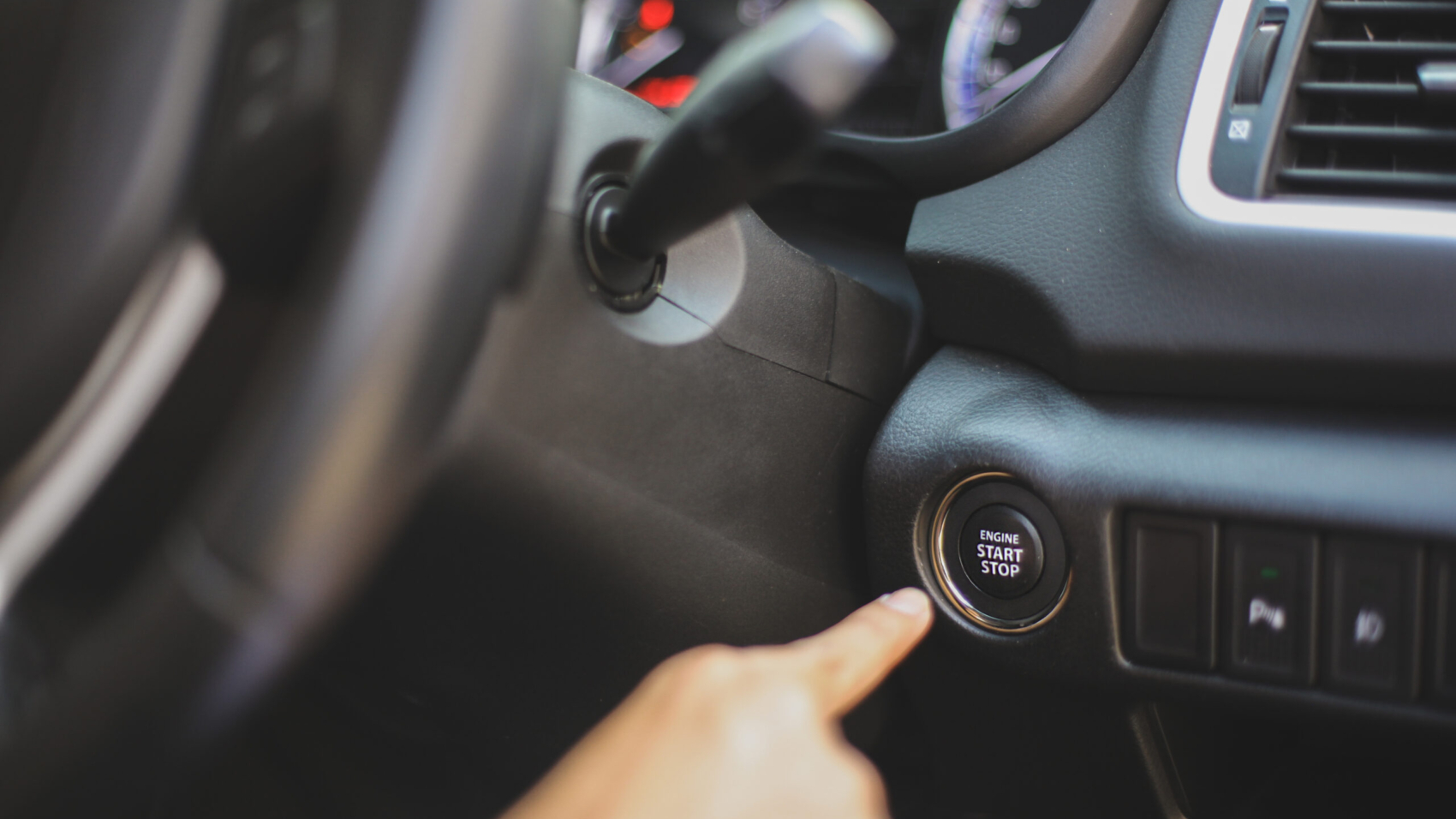 hand-push-start-car-engine-button-2021-09-30-16-35-44-utc